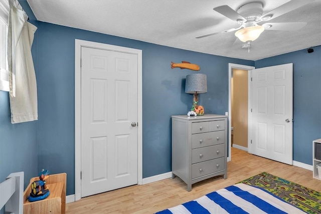 144 Hines Rd, Cumberland, RI 02864 - bedroom with light wood-type flooring and ceiling fan