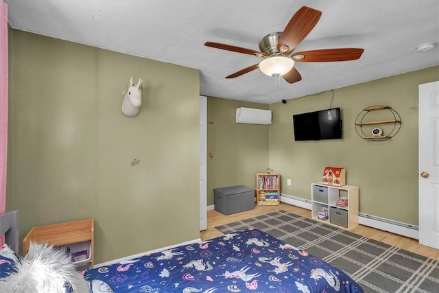 144 Hines Rd, Cumberland, RI 02864 - bedroom with baseboard heating, ceiling fan, and wood finished floors