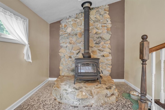 144 Hines Rd, Cumberland, RI 02864 - detailed view of a wood stove and baseboards