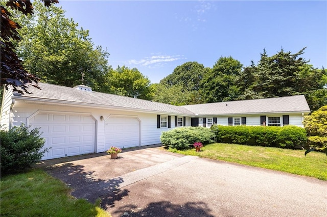 2 Quail Run, Westerly, RI 02891 - ranch-style home with asphalt driveway, an attached garage, and a front lawn