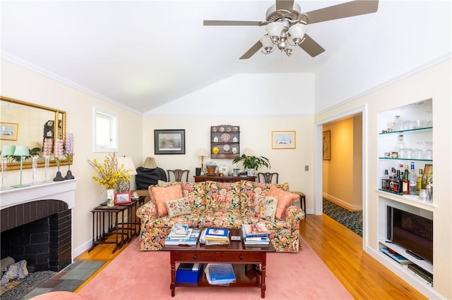 2 Quail Run, Westerly, RI 02891 - living area with wood finished floors, a ceiling fan, a fireplace, lofted ceiling, and a dry bar
