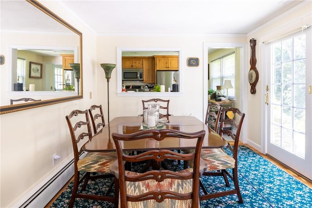2 Quail Run, Westerly, RI 02891 - dining room featuring wood finished floors and a baseboard radiator