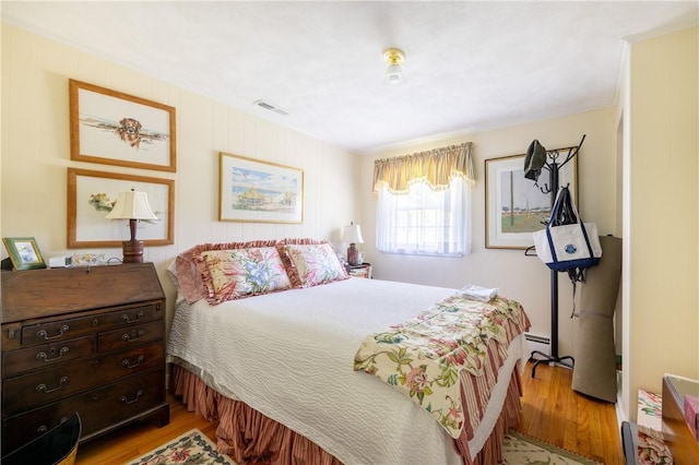 2 Quail Run, Westerly, RI 02891 - bedroom featuring light wood-style floors and a baseboard heating unit