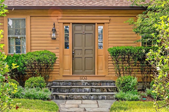 603 E Ave, Pawtucket, RI 02860 - doorway to property featuring roof with shingles