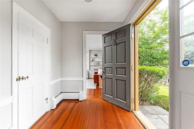 603 E Ave, Pawtucket, RI 02860 - entryway with wood finished floors and a baseboard radiator