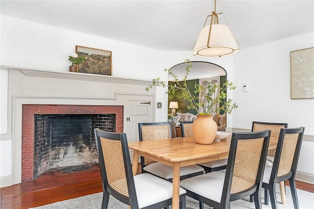 603 E Ave, Pawtucket, RI 02860 - dining room with wood finished floors and a fireplace with flush hearth