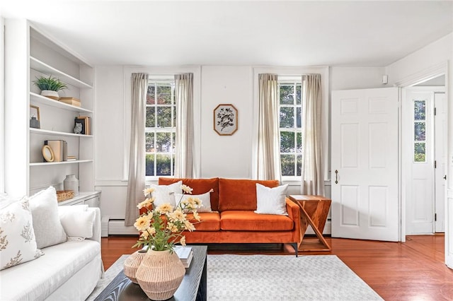 603 E Ave, Pawtucket, RI 02860 - living area with wood finished floors, baseboard heating, and built in shelves