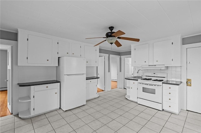 289 Mowry St, Woonsocket, RI 02895 - kitchen featuring white appliances, dark countertops, ceiling fan, white cabinets, and tasteful backsplash