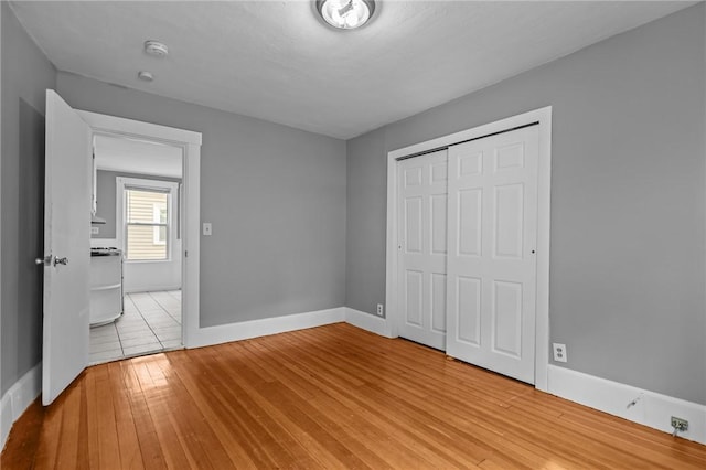 289 Mowry St, Woonsocket, RI 02895 - unfurnished bedroom with wood-type flooring and a closet