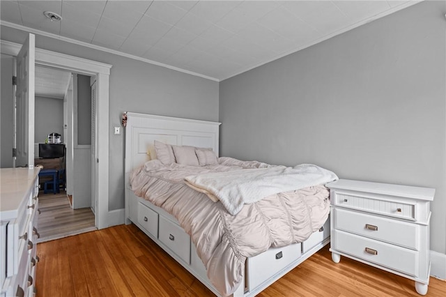 289 Mowry St, Woonsocket, RI 02895 - bedroom with light wood finished floors and ornamental molding