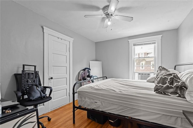 289 Mowry St, Woonsocket, RI 02895 - bedroom with light wood finished floors and a ceiling fan