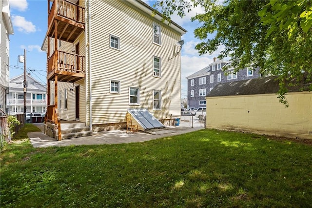 289 Mowry St, Woonsocket, RI 02895 - rear view of house with a balcony and a patio