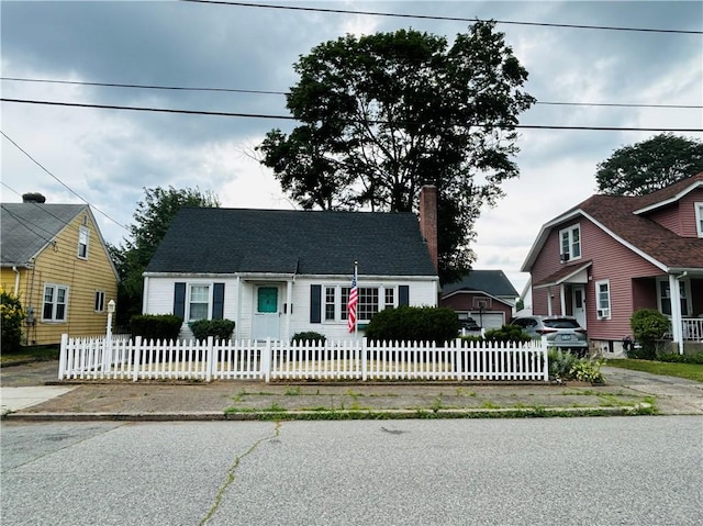 51 Benjamin St, Pawtucket, RI 02861 - cape cod house with a chimney and a fenced front yard