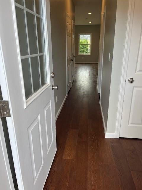 99 Ayda Rose Ave, West Warwick, RI 02893 - corridor with baseboards and dark wood-style flooring