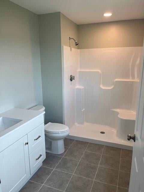 99 Ayda Rose Ave, West Warwick, RI 02893 - bathroom with vanity, a walk in shower, tile patterned floors, and recessed lighting