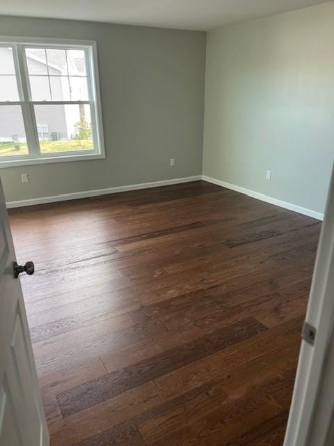 99 Ayda Rose Ave, West Warwick, RI 02893 - empty room with dark wood-style flooring and baseboards