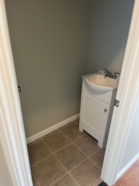 99 Ayda Rose Ave, West Warwick, RI 02893 - bathroom with vanity and tile patterned flooring