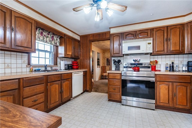 64 Riverfarm Rd, Cranston, RI 02910 - kitchen featuring white appliances, light countertops, backsplash, a ceiling fan, and brown cabinets