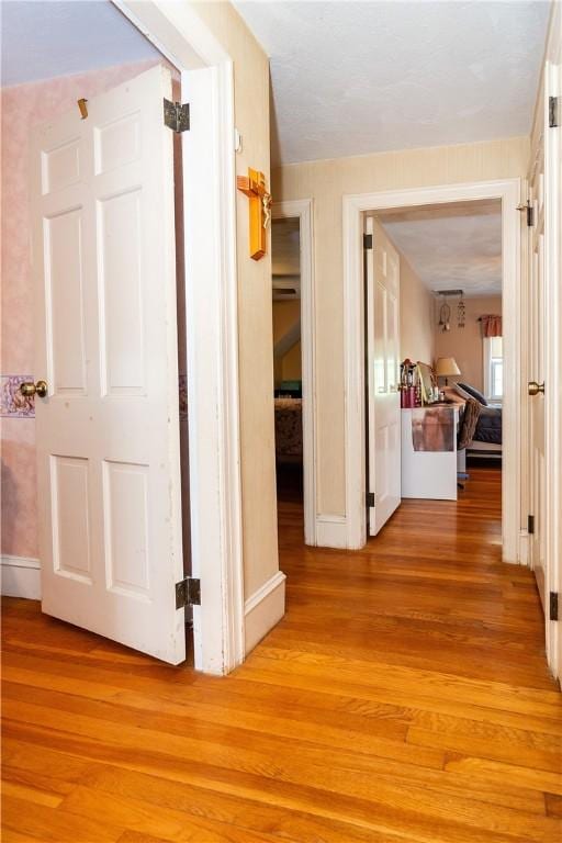 64 Riverfarm Rd, Cranston, RI 02910 - corridor with light wood-style flooring and baseboards