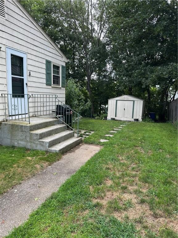 103 Windsor Park Dr, Coventry, RI 02816 - view of green lawn with a storage shed
