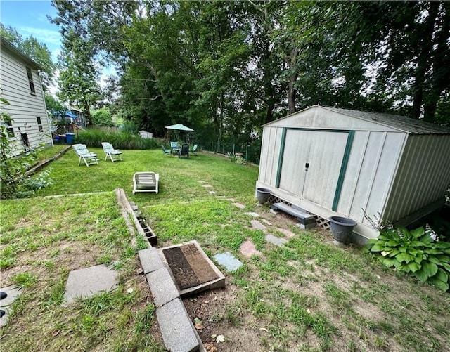 103 Windsor Park Dr, Coventry, RI 02816 - view of green lawn featuring a storage shed
