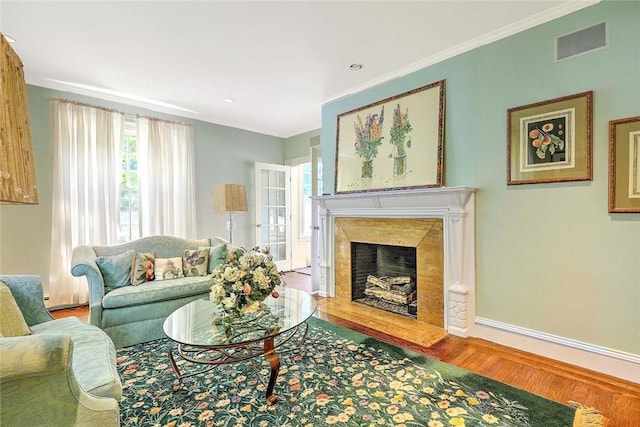29 Orchard Ave, Providence, RI 02906 - living area with wood finished floors, ornamental molding, a premium fireplace, and recessed lighting