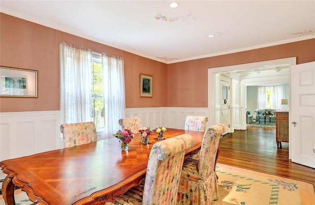 29 Orchard Ave, Providence, RI 02906 - dining area with wainscoting, wood finished floors, ornamental molding, and a decorative wall
