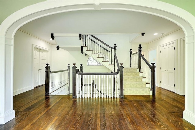 29 Orchard Ave, Providence, RI 02906 - stairway with arched walkways, wood finished floors, and crown molding