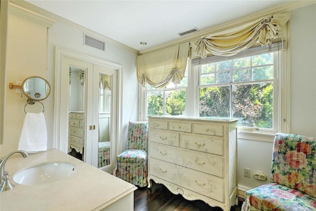29 Orchard Ave, Providence, RI 02906 - ensuite bathroom featuring vanity, crown molding, and wood finished floors