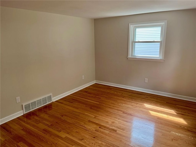18 Louisiana Ave, Warwick, RI 02888 - empty room with wood finished floors and baseboards