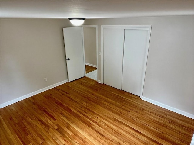18 Louisiana Ave, Warwick, RI 02888 - unfurnished bedroom featuring light wood finished floors and a closet