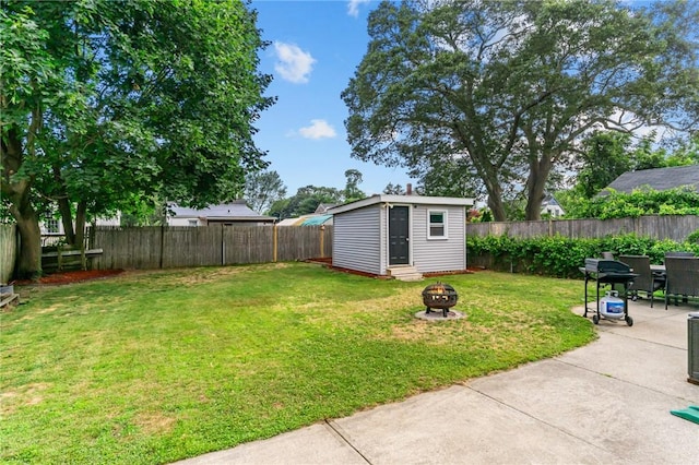 160 Coburn St, Warwick, RI 02889 - fenced backyard featuring an outdoor fire pit, an outbuilding, and a patio