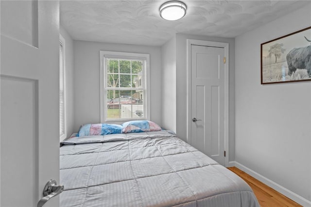160 Coburn St, Warwick, RI 02889 - bedroom with baseboards and wood finished floors