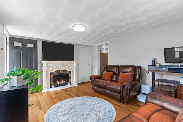 160 Coburn St, Warwick, RI 02889 - living room with wood finished floors and a warm lit fireplace