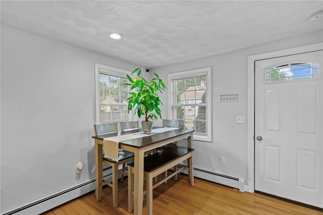 160 Coburn St, Warwick, RI 02889 - dining area with light wood-type flooring, recessed lighting, and a baseboard radiator