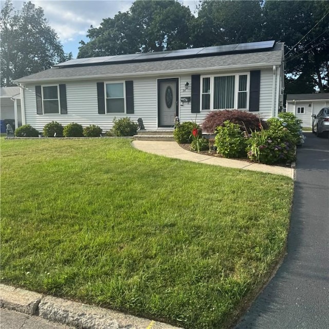 34 Ridge St, East Providence, RI 02914 - ranch-style house with solar panels and a front yard