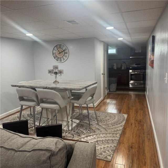 34 Ridge St, East Providence, RI 02914 - dining room featuring dark wood finished floors and a drop ceiling
