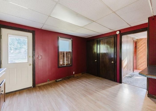 15 Hope Ct, West Warwick, RI 02893 - entrance foyer featuring a paneled ceiling, light wood-style floors, and plenty of natural light