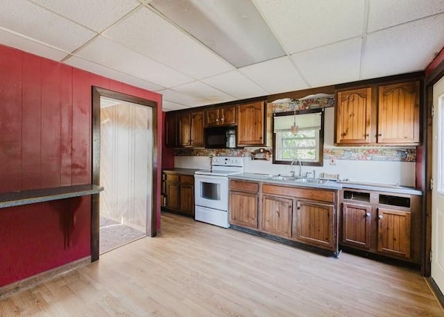 15 Hope Ct, West Warwick, RI 02893 - kitchen featuring white electric range oven, black microwave, a drop ceiling, and light wood-style flooring