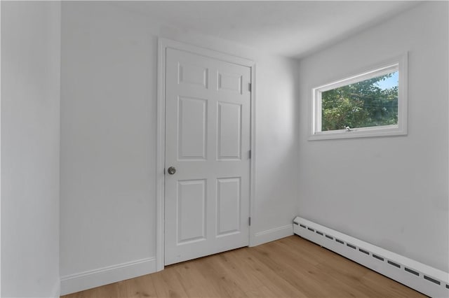 15 Maplewood Ave, Warwick, RI 02889 - empty room featuring baseboard heating and light wood-type flooring