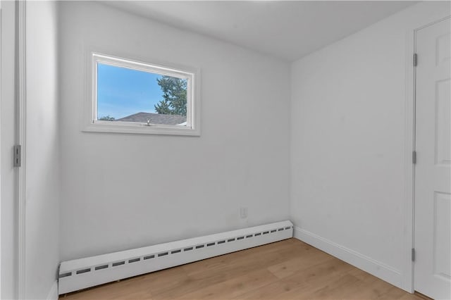 15 Maplewood Ave, Warwick, RI 02889 - unfurnished bedroom featuring a baseboard radiator and light wood-style flooring