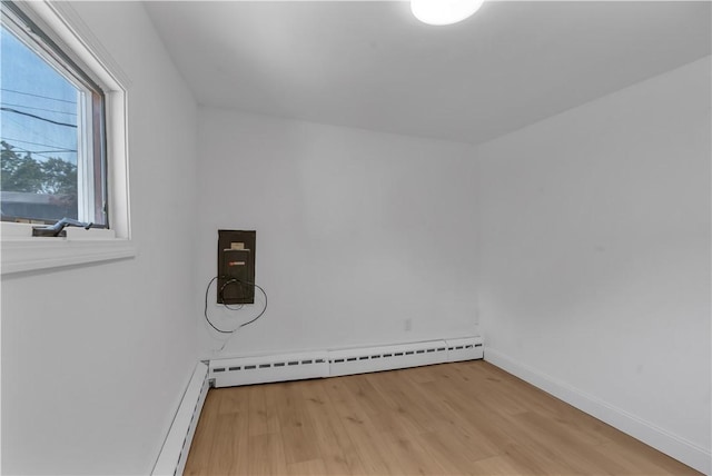 15 Maplewood Ave, Warwick, RI 02889 - laundry area with wood finished floors and baseboards