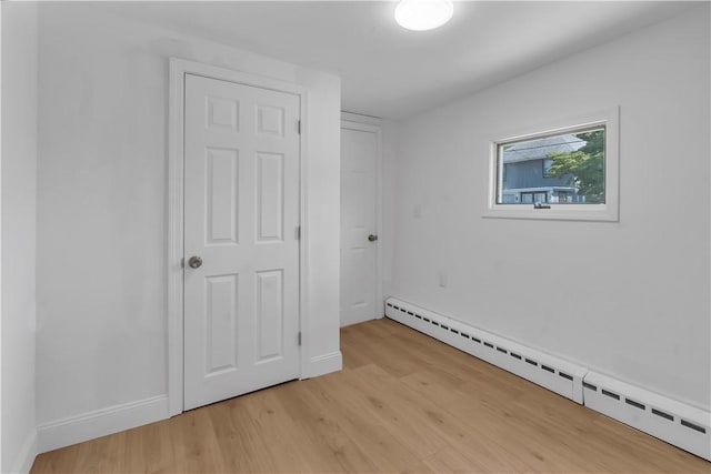 15 Maplewood Ave, Warwick, RI 02889 - unfurnished bedroom with a baseboard radiator and light wood-style floors