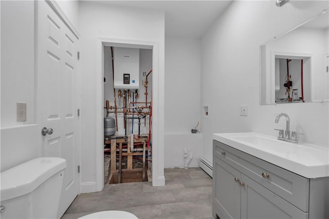 15 Maplewood Ave, Warwick, RI 02889 - bathroom featuring tankless water heater, vanity, and baseboard heating