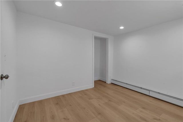15 Maplewood Ave, Warwick, RI 02889 - unfurnished room featuring a baseboard heating unit, light wood finished floors, and recessed lighting