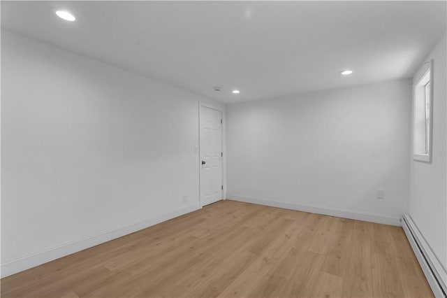 15 Maplewood Ave, Warwick, RI 02889 - unfurnished room with a baseboard radiator, recessed lighting, and light wood finished floors