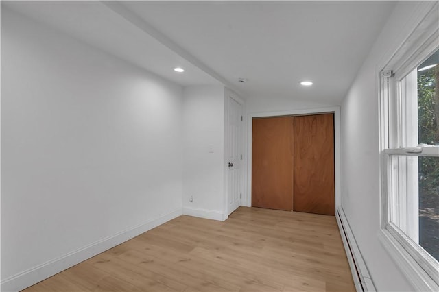 15 Maplewood Ave, Warwick, RI 02889 - empty room with a baseboard heating unit, recessed lighting, and light wood finished floors
