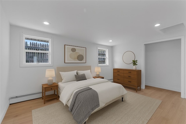 15 Maplewood Ave, Warwick, RI 02889 - bedroom with light wood-type flooring, baseboard heating, recessed lighting, and multiple windows