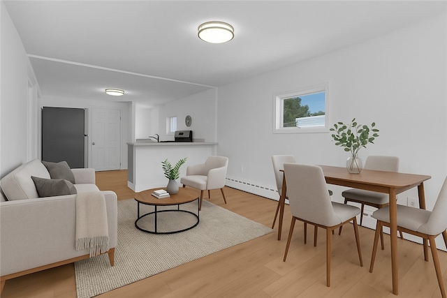 15 Maplewood Ave, Warwick, RI 02889 - dining area featuring a baseboard radiator and light wood-style floors