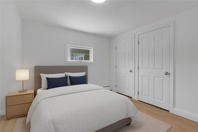 15 Maplewood Ave, Warwick, RI 02889 - bedroom with light wood-style floors and baseboards